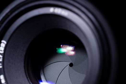 Lens aperture low light photo. closeup. Aperture blades is clean and dark. Stock photo isolated on black background.