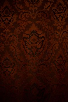Expensive dark orange home curtains with a very beautiful frilly pattern. Texture shot. Good background or wallpapers.