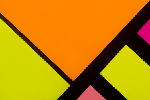 Purple, yellow, orange and rose hue colorful office stickers on black paper. Office noteparer as reminder. Isolated on black paper.
