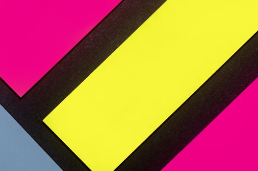 Blue, yellow and purple hue colorful office stickers on black paper. Office noteparer as reminder. Isolated on black paper.