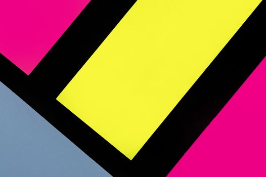Blue, yellow and purple hue colorful office stickers on black paper. Office noteparer as reminder. Isolated on black paper.