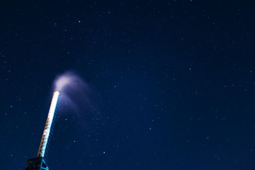 Long exposure night sky stars photo. Boiler tube on foreground. A lot of stars with constellations. Far from the city. Night landscape.