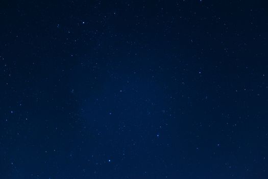 Long exposure night sky stars photo. A lot of stars with constellations. Far from the city. Night landscape.