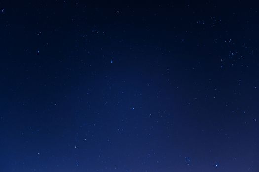 Long exposure night sky stars photo. A lot of stars with constellations. Far from the city. Night landscape.