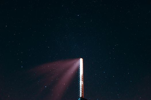 Long exposure night sky stars photo. Boiler tube on foreground. A lot of stars with constellations. Far from the city. Night landscape.