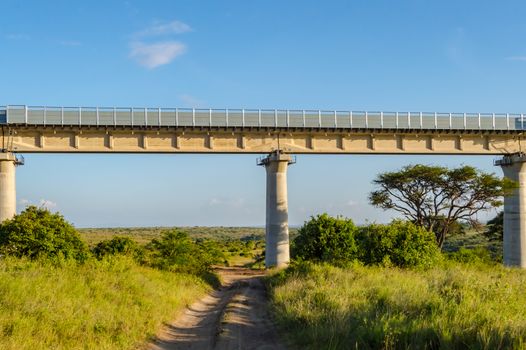 View of the viaduct of the Nairobi railroad to mombassa in the savannah of Nairobi Park in central Kenya