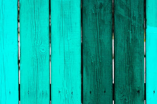 painted fence of wooden boards