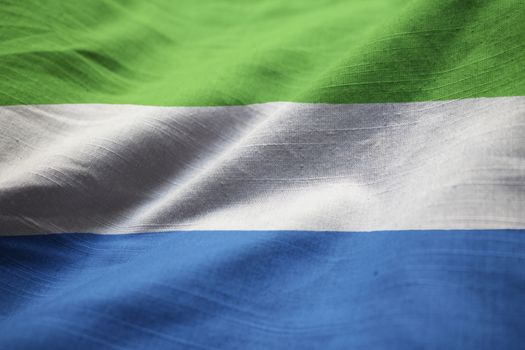Closeup of Ruffled Sierra Leone Flag, Sierra Leone Flag Blowing in Wind