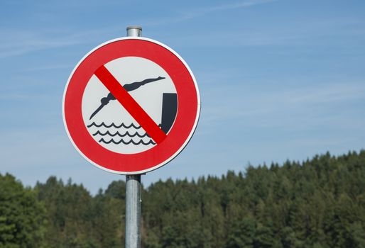 No Swimming sign posted on a lake in belgium