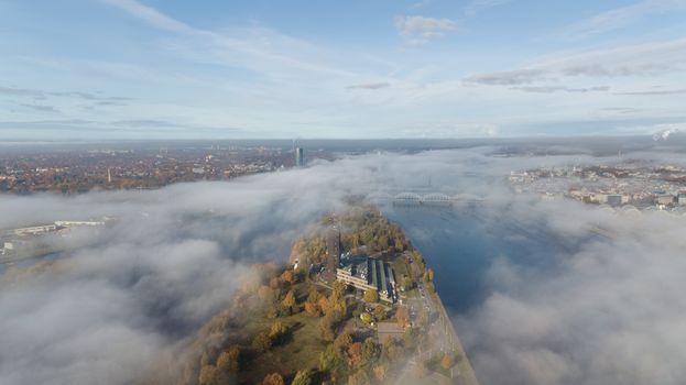 Riga Latvia Daugava river Zakusala island smoke cloud island Aerial drone top view