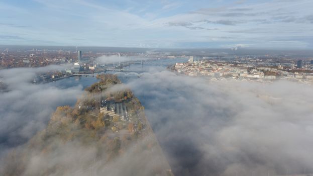 Riga Latvia Daugava river Zakusala island smoke cloud island Aerial drone top view