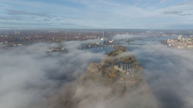Riga Latvia Daugava river Zakusala island smoke cloud island Aerial drone top view