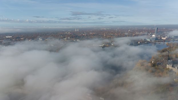 Riga Latvia Daugava river Zakusala island smoke cloud island Aerial drone top view