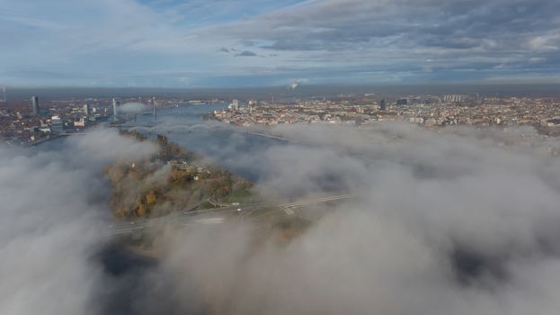 Riga Latvia Daugava river Zakusala island smoke cloud island Aerial drone top view