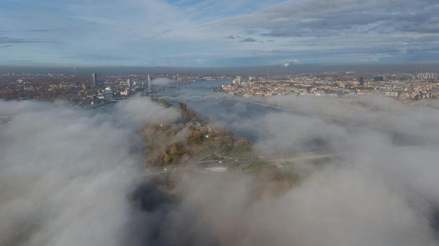 Riga Latvia Daugava river Zakusala island smoke cloud island Aerial drone top view