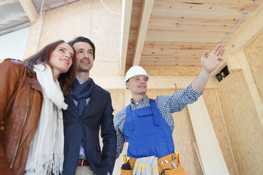 Foreman shows new house to a young couple