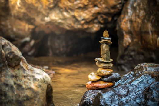 Stone balance stacking at riverside and morning sunlight. Concepts of Concepts of Zen religion or meditation practice.