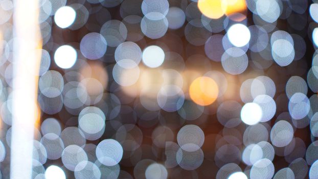 Christmas gold background. Golden holiday glowing backdrop. Defocused Background With Blinking Stars. Blurred Bokeh curtain