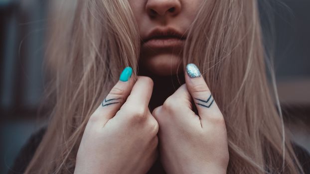 The lady hand with tattoo, small tattoo, closeup photo