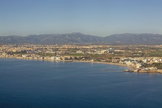 Aerial view of Portixol and Molinar coastline on a sunny winter day in December in Palma de Mallorca, Spain.