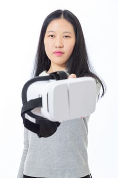 Teenage Asian high school girl passing 3D goggles