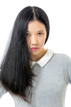 Teenage Asian high school girl portrait with hair hanging in front of half face