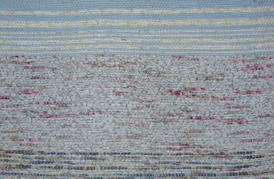 Rustic woven cotton rug texture background blue white and red colors