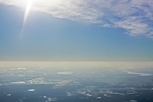 Aerial view over Arlanda airport in sunhaze, Sweden in February.