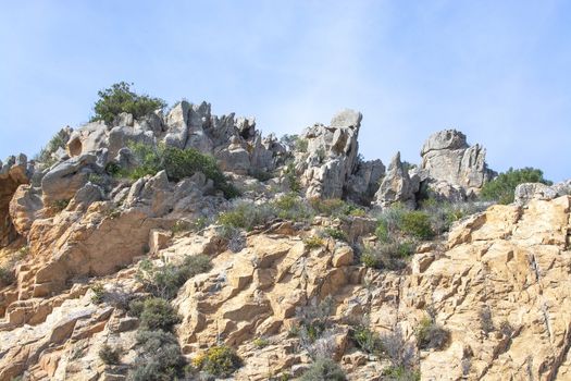 Granite rock shapes against blue sky in Costa Smeralda, Sardinia, Italy.