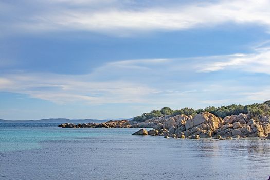 Seascape from a winter beach and blue and green sea in Costa Smeralda, Sardinia, Italy in March.