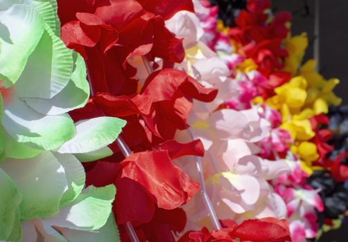 Lei flower garland in many colours closeup background
