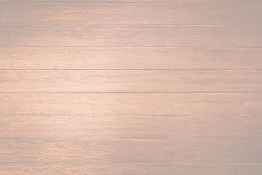 Brown wood planks background texture closeup toned in trend color Living Coral.