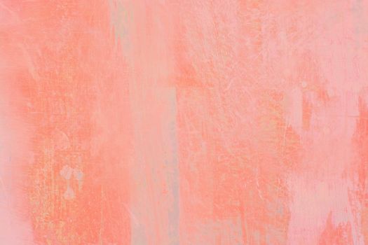Grungy red roughcast wall scratchy background texture in pink and green toned in trend color Living Coral.