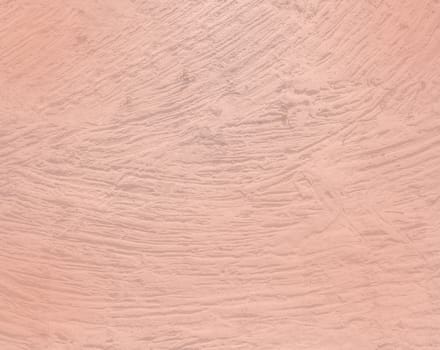 Old vintage handmade strokes concrete or roughcast background texture toned in trend color Living Coral.