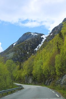 Picturesque spring Norway landscape with asphalt road