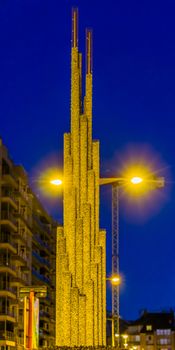 city decoration, simple art work made out of mesh cylinders filled with shiny rocks, cylinders in different sizes