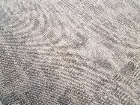 grey carpet or rug textile on the ground or floor