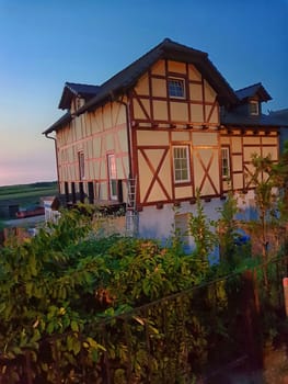 Historic half timbered house on the baltic sea in front of blue sky, Germany