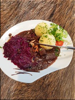 Gourmet game fillet with potato dumplings, goulash garnished