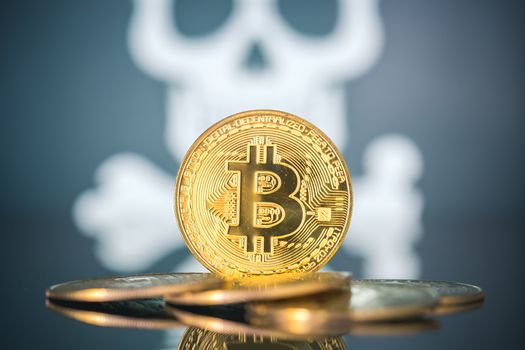 Bitcoin fail concept, Golden bitcoin with skull and bones in the background. Dark background
