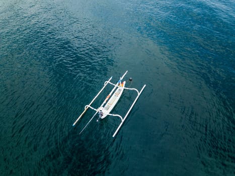 Aerial view of traditional Indonesian fishing boat called jukung