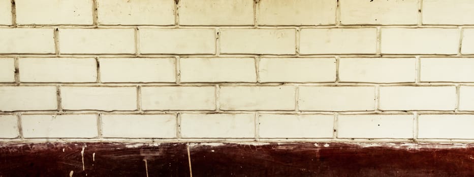 Panoramic canvas of old uneven block shape white and red color wide brick wall background of a vintage house facade. Modern style design decorative ideas. Studio shot with copy space room for text