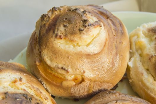 Hot sweet rolls in the shape of snails baked in a homemade bakery, closeup, concept of small business, bakeries, mini-hotel.