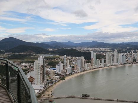 July 09, 2015, Balneario Camboriú, Santa Catarina, Brazil, Panoramic view, from a lookout point, city, sea and mountains, and background with clouds in the sky.