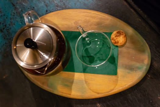 a closeup shoot from above of a tea pot and glass. photo has taken from a cafe at izmir/turkey.