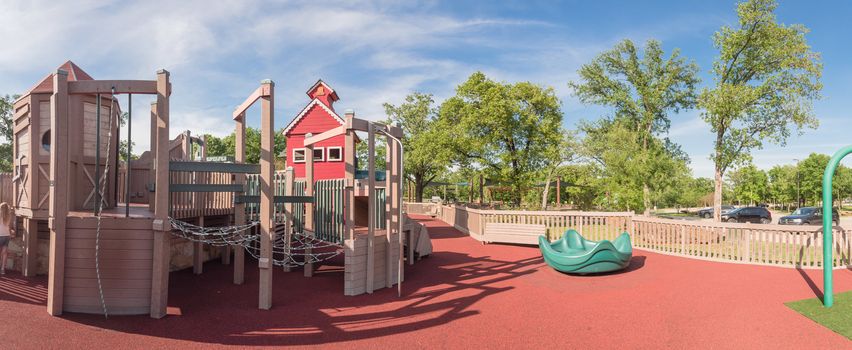 Panorama view castle-inspired structure, elaborate wooden playground with soft rubber surface near Dallas, Texas, USA