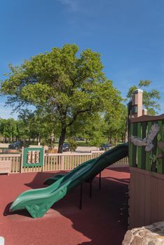 Wooden playground, castle-inspired structure with soft rubber surface near Dallas, Texas, USA