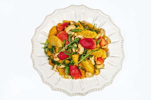 Porcelain plate with salad on an isolated studio background
