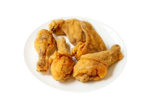 Plated of full original recipe fried chicken, isolated on white background.