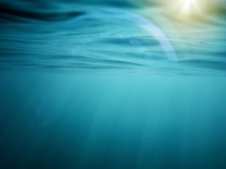 photo of an underwater background with golden sunbeams reflected in the curly surface of blue and turquoise water, there is a nice flare and some rays produced by light